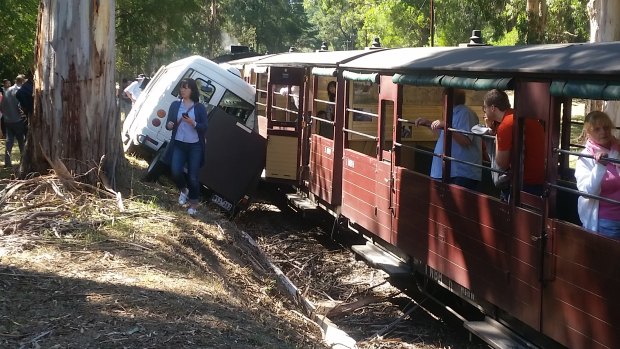 A tour bus and the Puffing Billy Steam Train collided. 