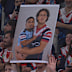 A fan made a sign of Mark Nawaqanitawase holding a baby-like Ronaldo Mulitalo for the semi final between the Sydney Roosters and Cronulla Sharks at Allianz Stadium.
