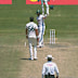 Wiaan Mulder and Mitchell Starc exchange words.