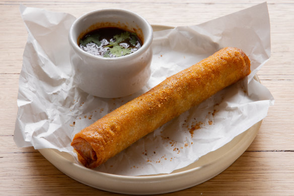 Birria spliff, a smoked beef and queso cheese cigar served with consomme.