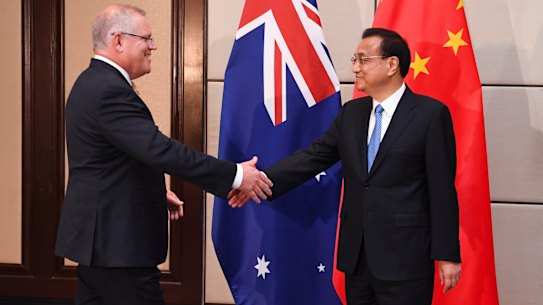 Prime Minister Scott Morrison shakes hands with Premier of the People's Republic of China Li Keqiang in 2019.