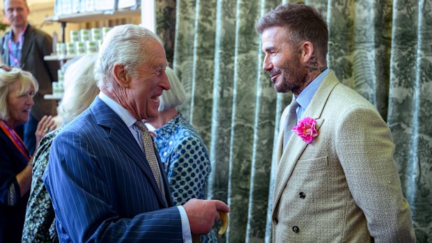 LONDON, ENGLAND - MAY 20: David Beckham wearing a David Austin Roses “King’s Rose” speaks with King Charles III, patron of the Royal Horticultural Society during a visit to the RHS Chelsea Flower Show at Royal Hospital Chelsea on May 20, 2025 in London, England. (Photo by Paul Grover - WPA Pool/Getty Images)