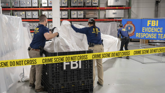 FBI special agents process material recovered from the balloon off the coast of South Carolina, at the FBI laboratory in Quantico, Virginia.