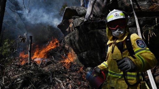 RFS Firefighter Jade Garrett from Killara brigade takes part in a 
hazard-reduction burn in Westleigh, in Sydney's north.