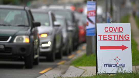Drivers queue up at a drive-through COVID-19 testing clinic in Auburn, Sydney on New Year's Day.