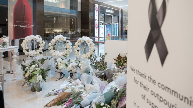 Westfield removes floral tributes as Bondi retailers hope for business as usual