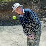 Bill Horn, 99, chipping a shot out of a bunker at Portsea Golf Club.