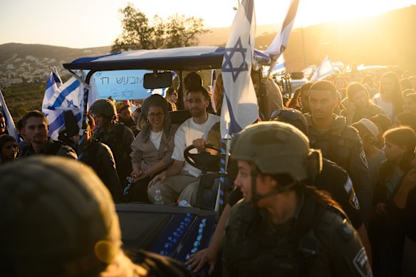 Released hostage Avinatan Or, arrives to hundreds of people cheering his return during a homecoming celebration in Shilo, an Israeli settlement in the West Bank.