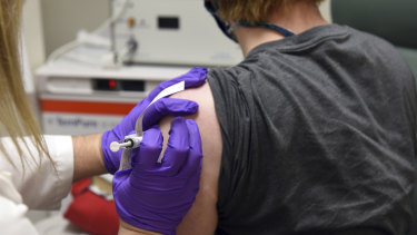This May 4, 2020, photo shows the first patient enrolled in Pfizer's COVID-19 coronavirus vaccine clinical trial at the University of Maryland School of Medicine in Baltimore.  