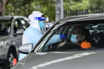 A Sydney resident gets tested for COVID-19 at the Fairfield Showgrounds yesterday. 
