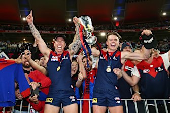 The Melbourne Demons celebrate after winning Saturdayâ€™s AFL grand final. 