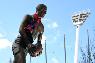 A Demons scarf adorns the statue of Jim Stynes outside the MCG