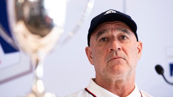 Master Lock Comanche co-skipper James Mayo, and the Illingworth Cup, awarded to first over the line at Hobart.