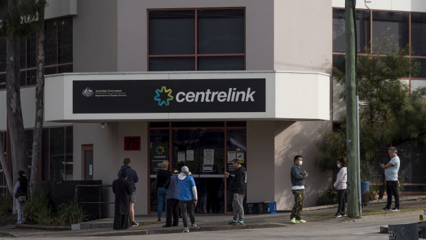 People queue outside Centrelink in Rockdale.