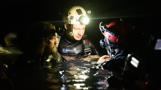 Cave divers Jim Warny, centre, and Erik Brown, left, play themselves in The Cave, the first film to document the extraordinary rescue of the Thai boys soccer team from Tham Luang cave in July 2018. 