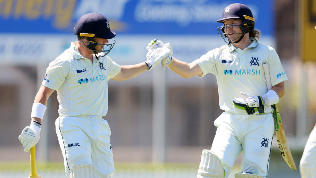 Victorian openers  Marcus Harris (left) and William Pucovski celebrate a record-breaking partnership against South Australia at ACH Group Stadium in Adelaide.