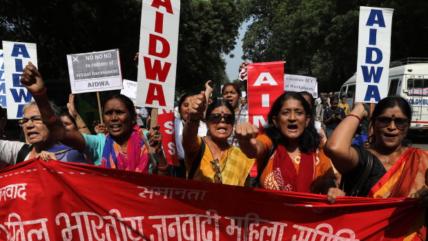 All India Democratic Women's Association members shout slogans during a protest against incidents of sexual assault and harassment in the workplace, in New Delhi on Friday.