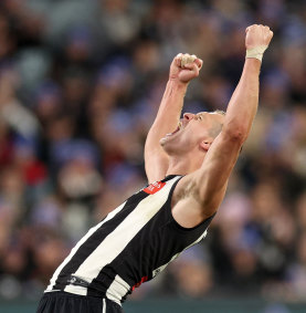 Nathan Kreuger celebrates a goal against the Demons on Monday.