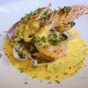 King prawns with pipis, mussels, grilled bread and fennel.