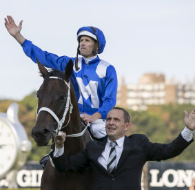 Jockey Hugh Bowman and trainer Chris Waller celebrate Winx’s Queen Elizabeth Stakes win in her final race in April 2019.