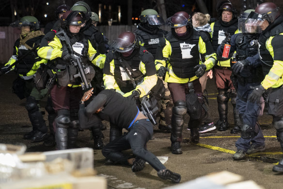 A demonstrator is arrested in Brooklyn Centre on Monday night. 