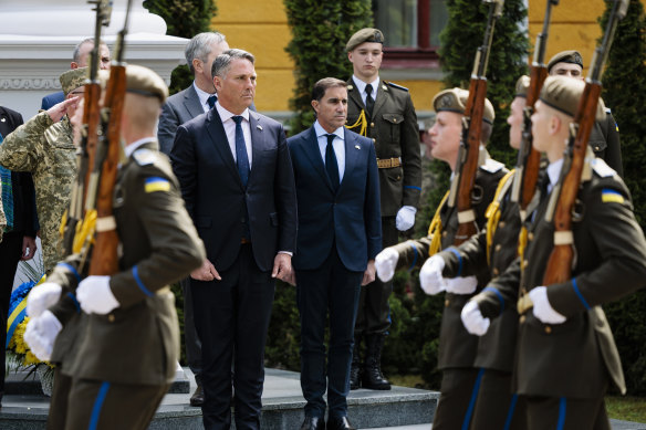 Defence Minister Richard Marles (left) and Australian Army chief Lieutenant General Simon Stuart at a ceremony for fallen Ukrainian soldiers in Lviv on Saturday. 