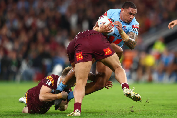 Tyson Frizell is wrapped up by Queensland’s fast-moving defence in Origin II.