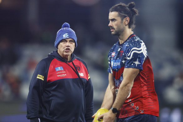 Brodie Grundy getting advice from Melbourne’s head of development Mark Williams.