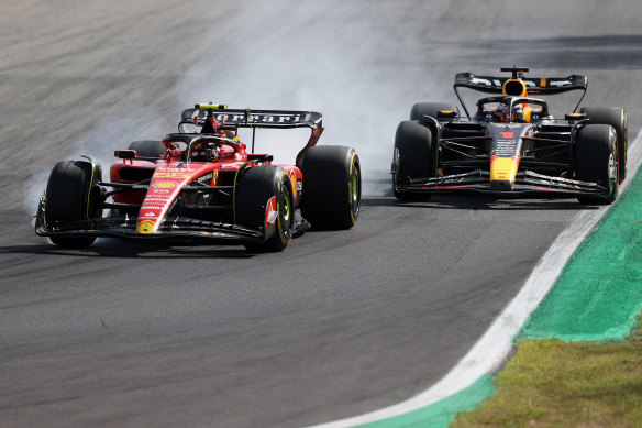 Ferrari’s Carlos Sainz comes under pressure from Red Bull’s Max Verstappen.
