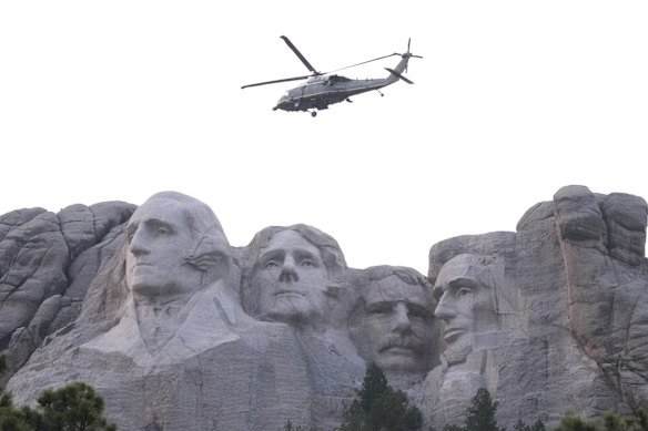Marine One, with President Donald Trump on board, passes Mount Rushmore.