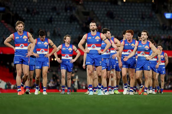 Skipper Marcus Bontempelli leads the bedraggled Bulldogs off Marvel Stadium, with their finals prospects hinging on the slim hope Essendon can beat Gold Coast.