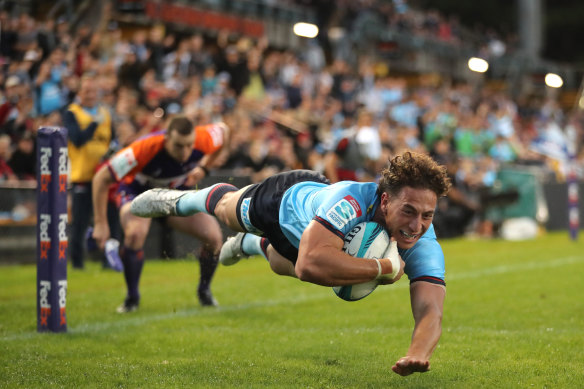 Mark Nawaqanitawase scores a try at a pumping Leichhardt Oval in 2022.