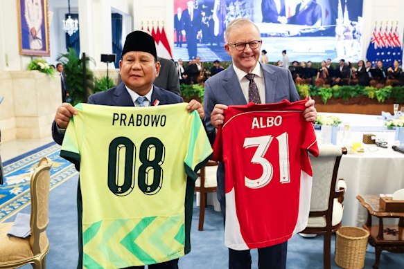 Prabowo Subianto and Anthony Albanese exchange soccer jerseys during lunch at Merdeka Palace in Jakarta.
