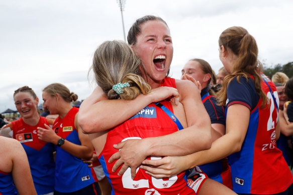 Kate Hore celebrates Melbourne’s maiden AFLW premiership.