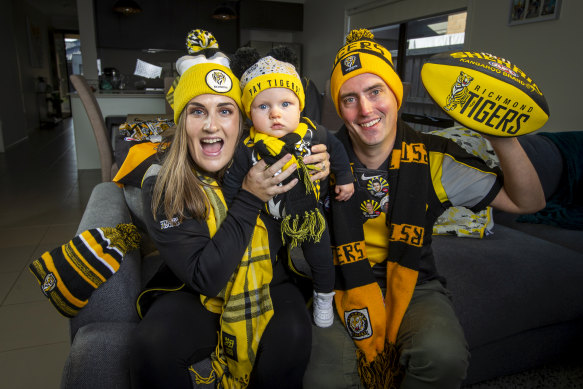 Richmond Tigers fans Amy and Clinton Brown with their son Law are looking forward to the footy.