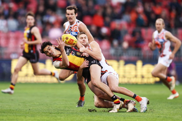 Mitchito Owens of the Saints is tackled by Harry Himmelberg of the Giants.