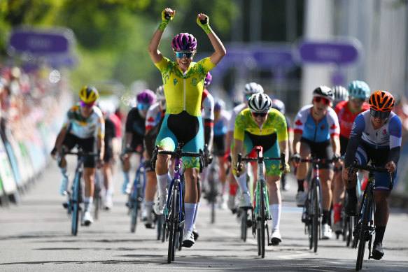 Georgia Baker celebrates after claiming the gold medal in the Commonwealth Games road race.