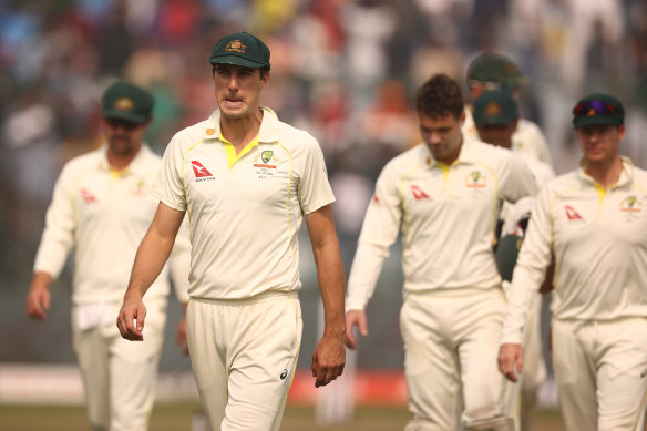 Pat Cummins leads the team off the ground after they were defeated by India during day three of the Second Test.