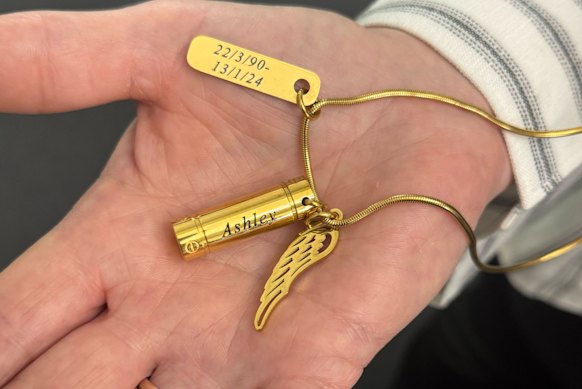 Ashley Gordon’s sister, Tammy Gordon, holds out a locket containing her brother’s hair.