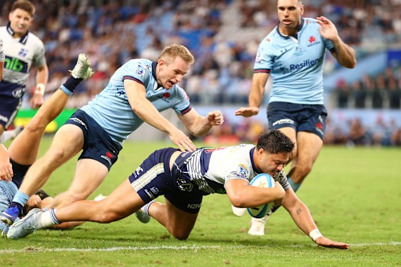 Max Jorgensen can’t stop AJ Lam going over for the Blues.