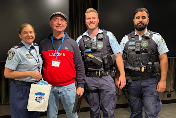 The author with three actual police officers: “I’ve got more empathy with street cops than I had before the course.”