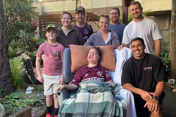 The Finn family with son Cam (centre) and Manly Sea Eagles pair Kieran Foran and Jamal Fogarty.