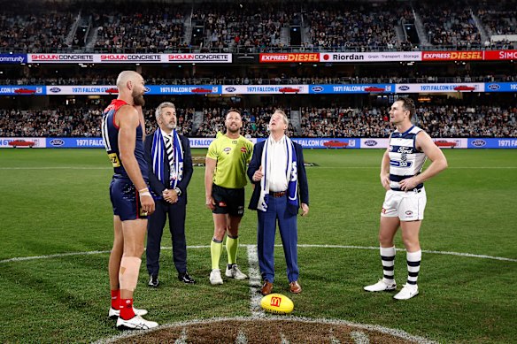 Bill Ford tosses the coin as Cats president Grant McCabe, Max Gawn and Patrick Dangerfield watch on.