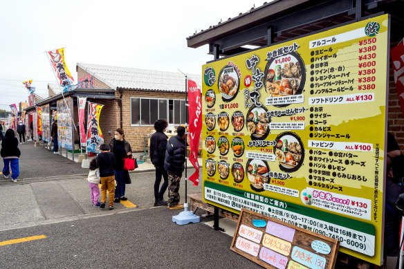 An oyster hut displays its menu outside. 