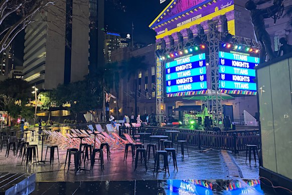 Puddles around a Magic Round activation in King George Square on Thursday night.