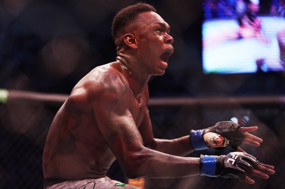 Israel Adesanya celebrates after beating Robert Whittaker in Melbourne last year.
