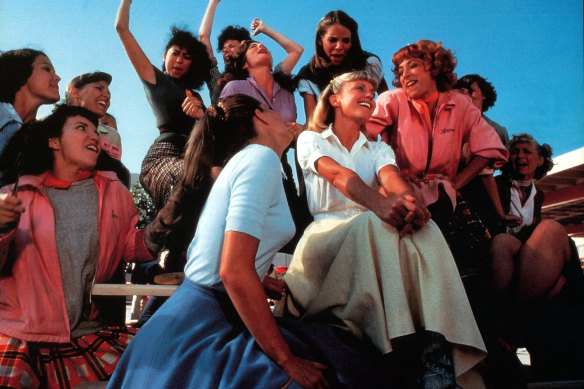 Olivia Newton-John (centre) with Didi Conn (right, in pink) singing Summer Lovin’ in Grease.