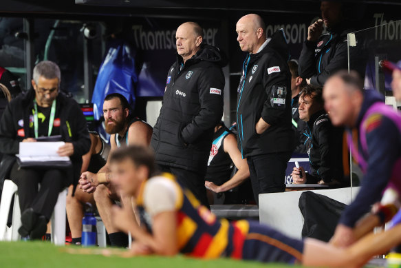 Port Adelaide Power coach Ken Hinkley watches from the bench during his side’s match against the Adelaide Crows.