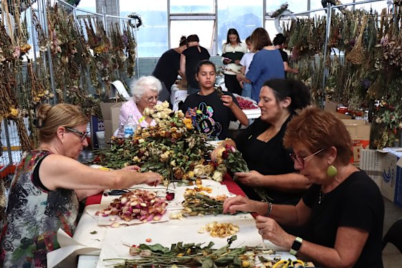 More than 100 volunteers preserving items left at the memorial at Bondi Pavilion.