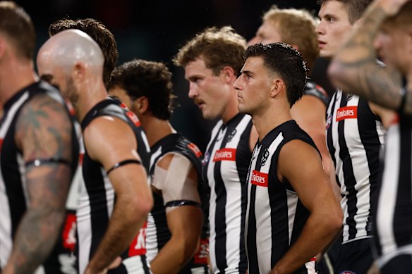A stone-faced Nick Daicos and teammates after Collingwood’s loss.
